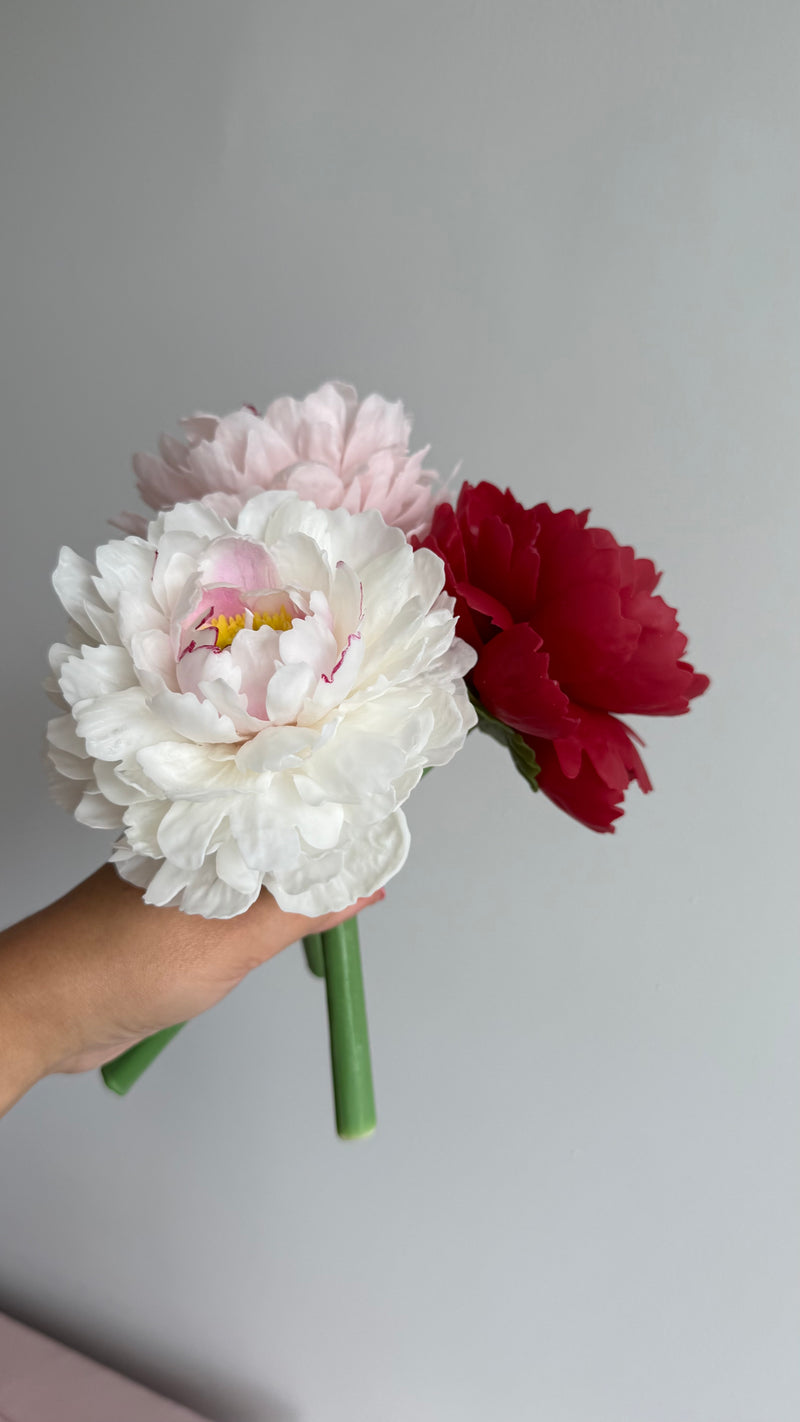 Realistic peony candle on a stem
