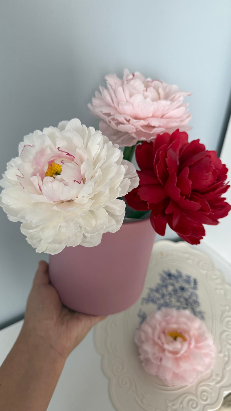 Realistic peony candle on a stem