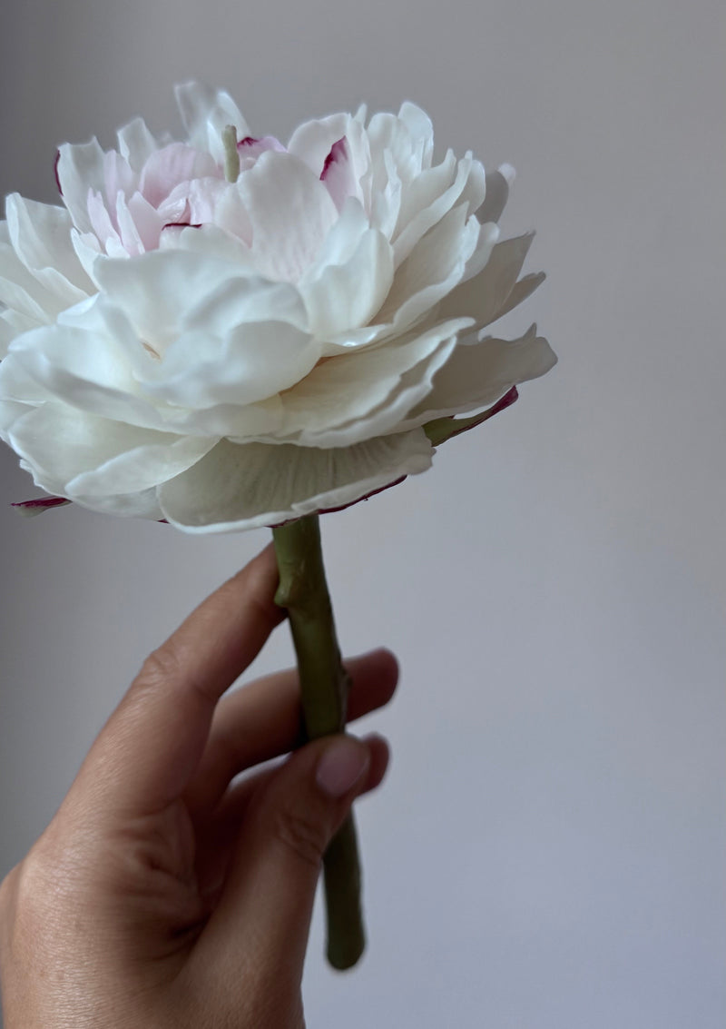 Realistic peony candle on a stem