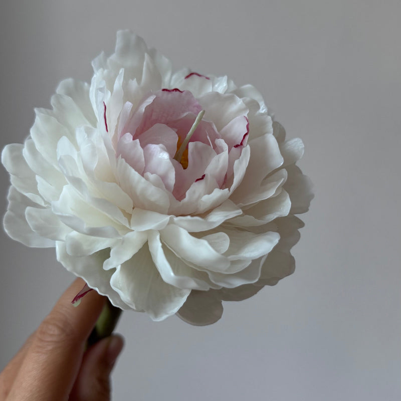 Realistic peony candle on a stem